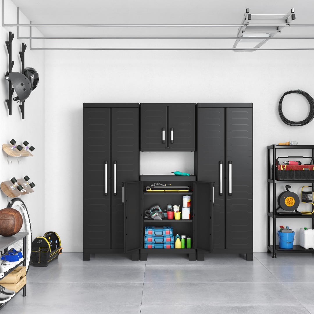 Garage shelving and tall storage cabinets organised with tools, equipment and household supplies.