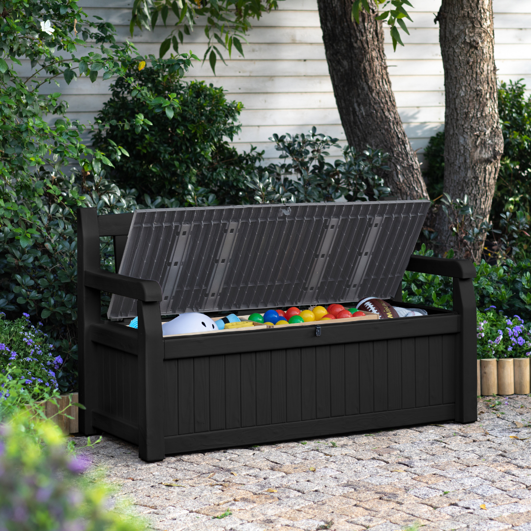 Eden 70G Bench Box Graphite with an open hinged lid revealing colourful toys and integrated bench seating in a dark woodgrain-effect finish