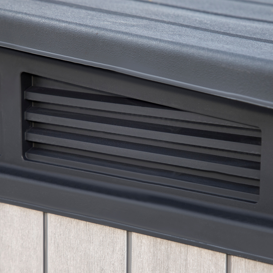 Elite Store close up showing a black ventilation grille beneath the ribbed roof edge and wood effect wall panels