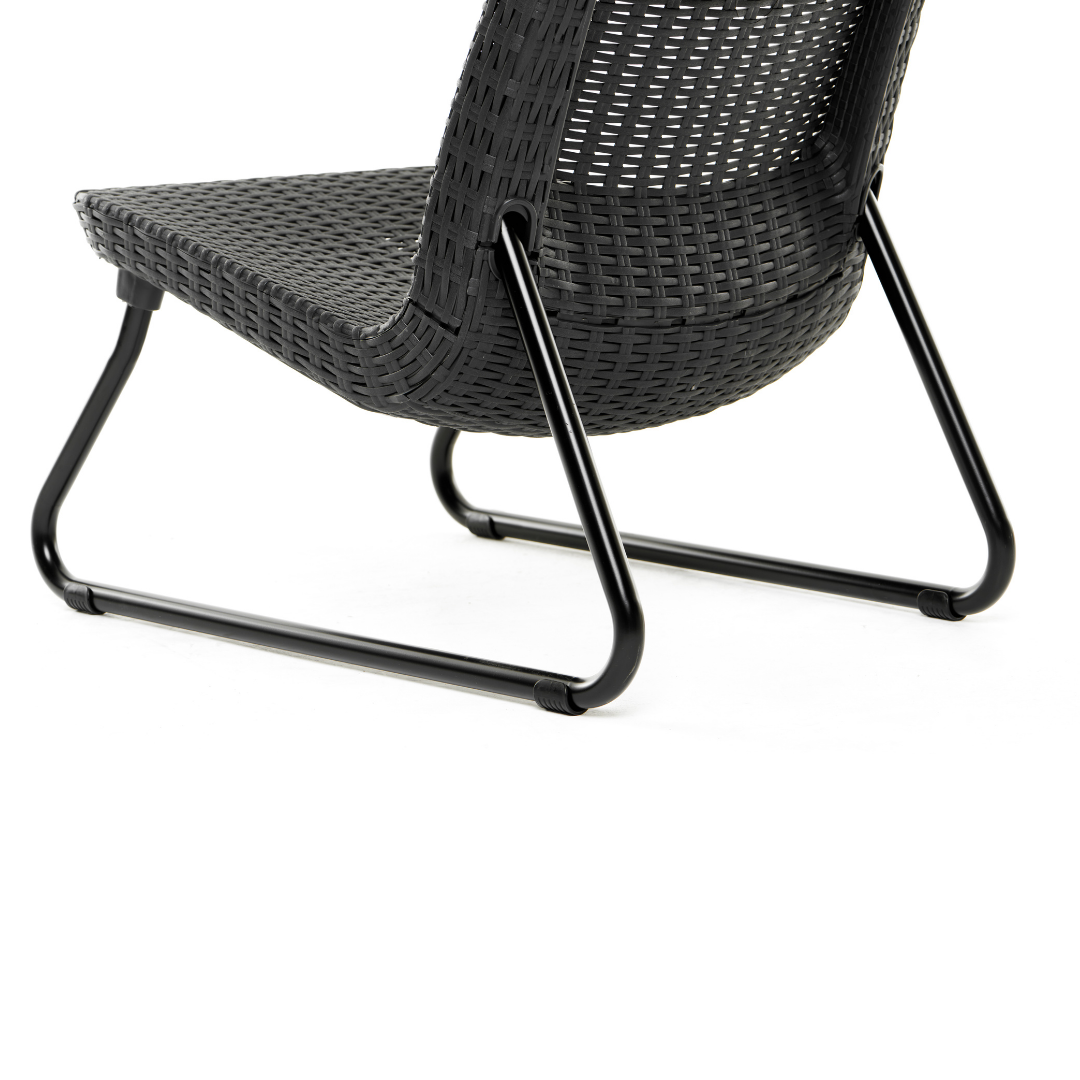 Rio Patio Set close-up of a graphite wicker-look chair with curved backrest and sturdy black sled-style legs